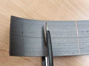 Mark the flexible strip with a biro and cut using sharp scissors